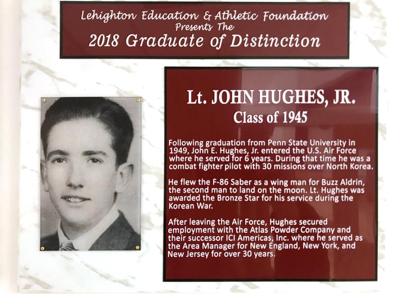 A plaque honoring Hughes, containing the same text as above.